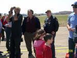 Reid Waltman (center) watches P-51 buzz Love Field